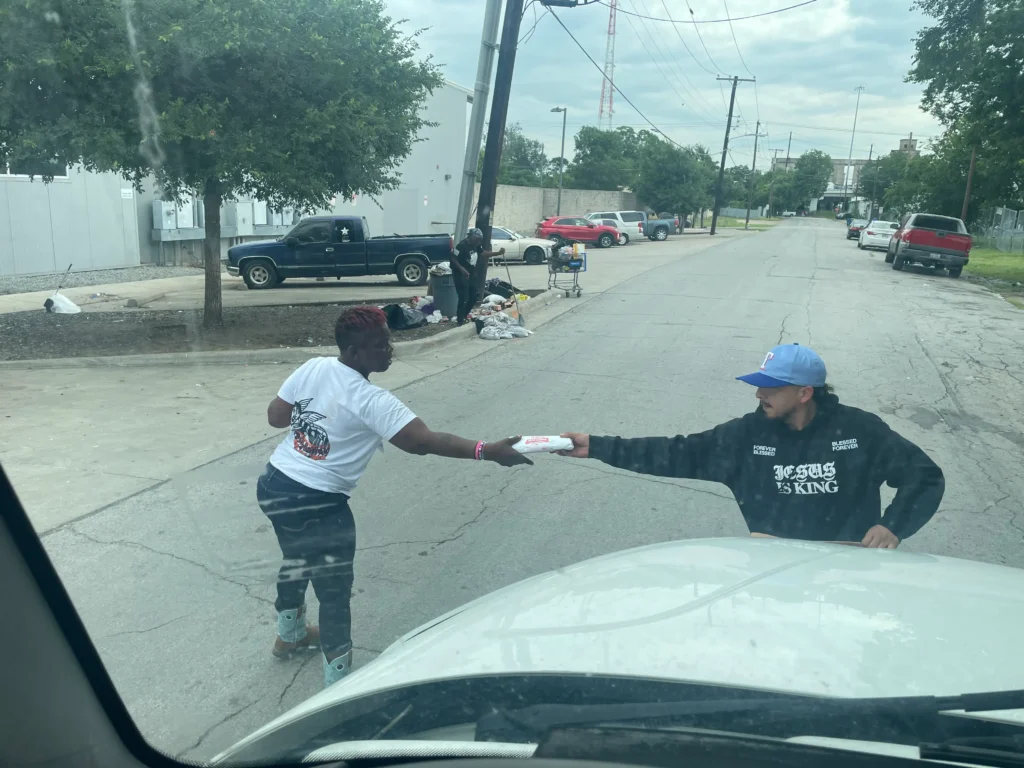 Volunteer providing food support during community outreach